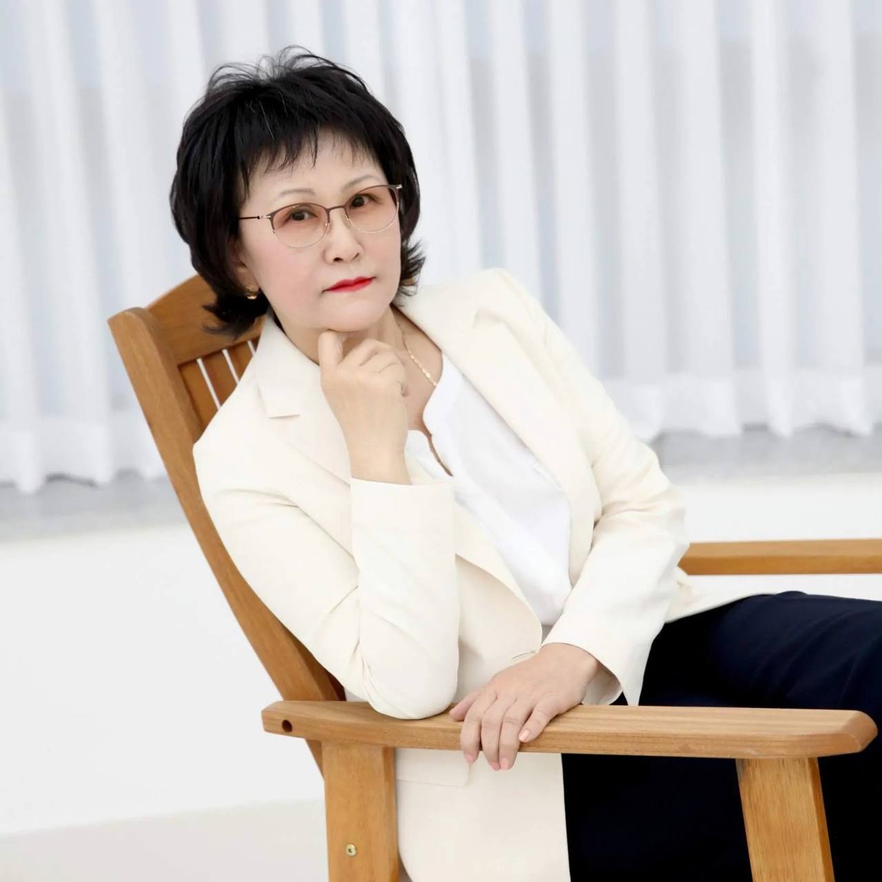 Laura Kim in elegant white blazer